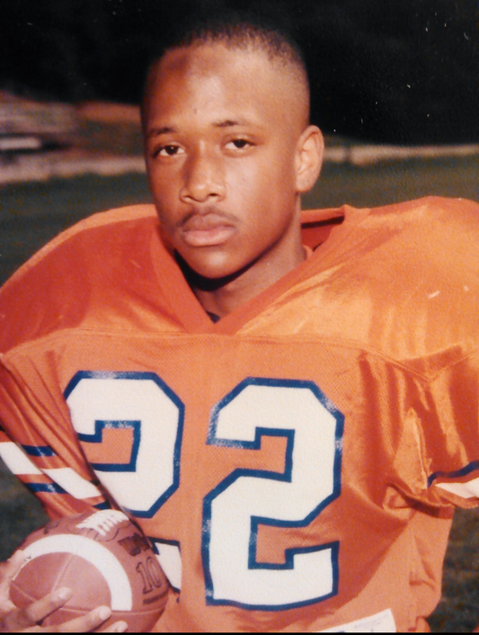 My brother, Tyree Cunningham, posing for his senior year football pictures. 